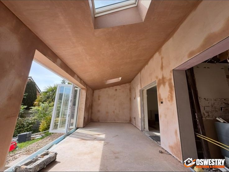 Large commercial interior freshly skimmed by Oswestry Plastering & Rendering, flat paint-ready walls and ceilings across an open-plan space